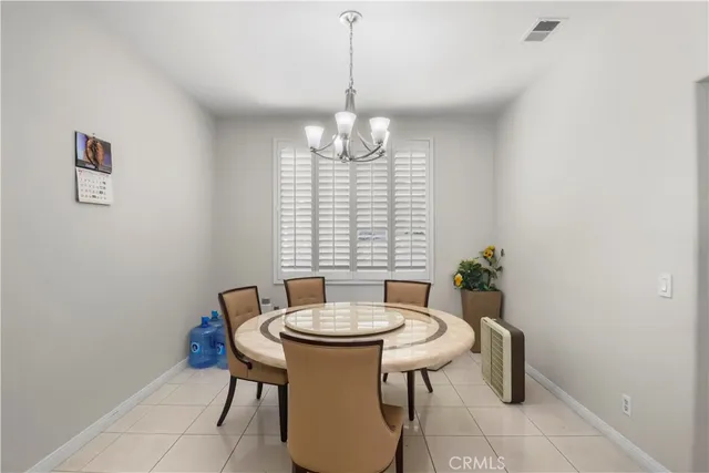 a view of a dining room with furniture and window