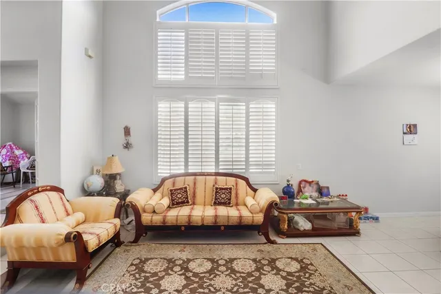 a bedroom with bed and windows
