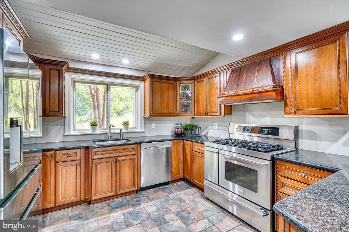 19701 Old York Road White Hall, MD 21161 - Photo 3 of 6 a kitchen with stainless steel appliances granite countertop stove top oven sink and cabinets