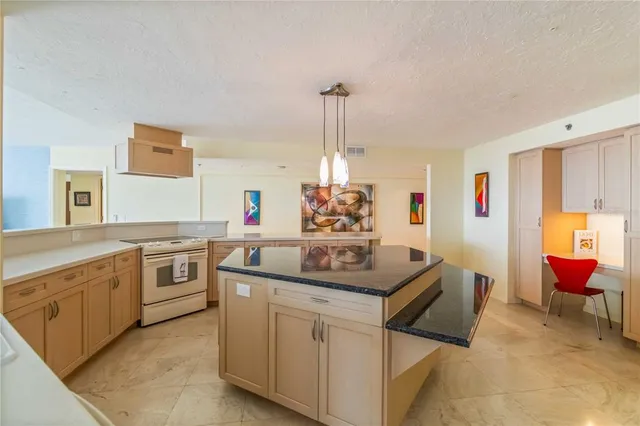 a kitchen with stainless steel appliances granite countertop sink and cabinets