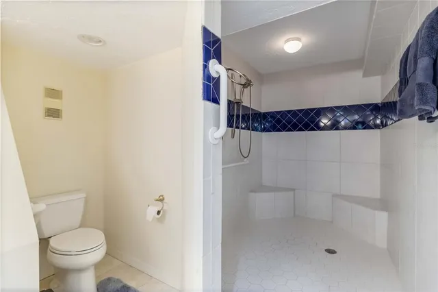 a bathroom with a double vanity sink and mirror