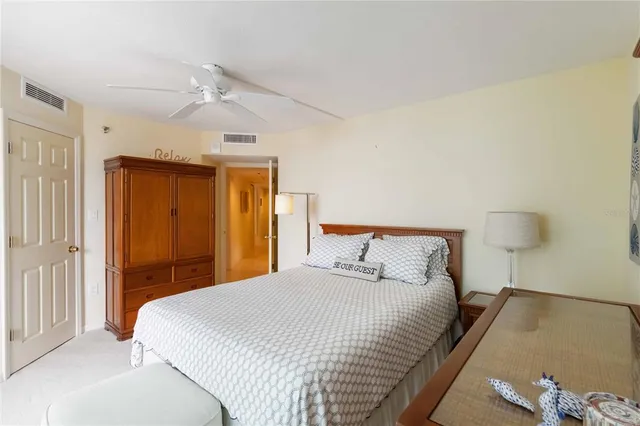 a bedroom with a bed and a dresser