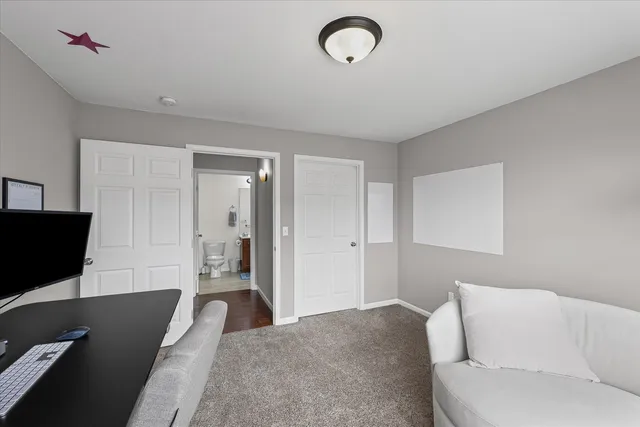 a living room with a couch and a flat screen tv