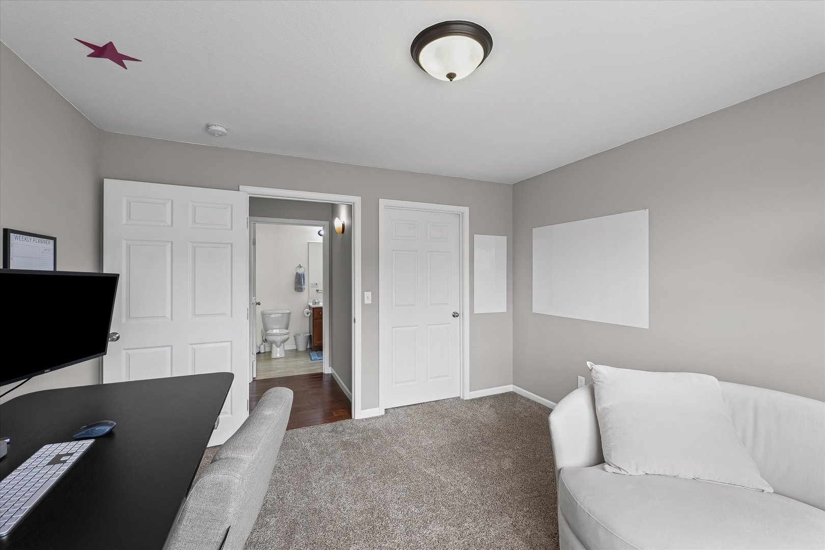 3044 East Stillwater Landing, Unit 201 Urbana, IL 61802 - Photo 23 of 28 a living room with a couch and a flat screen tv