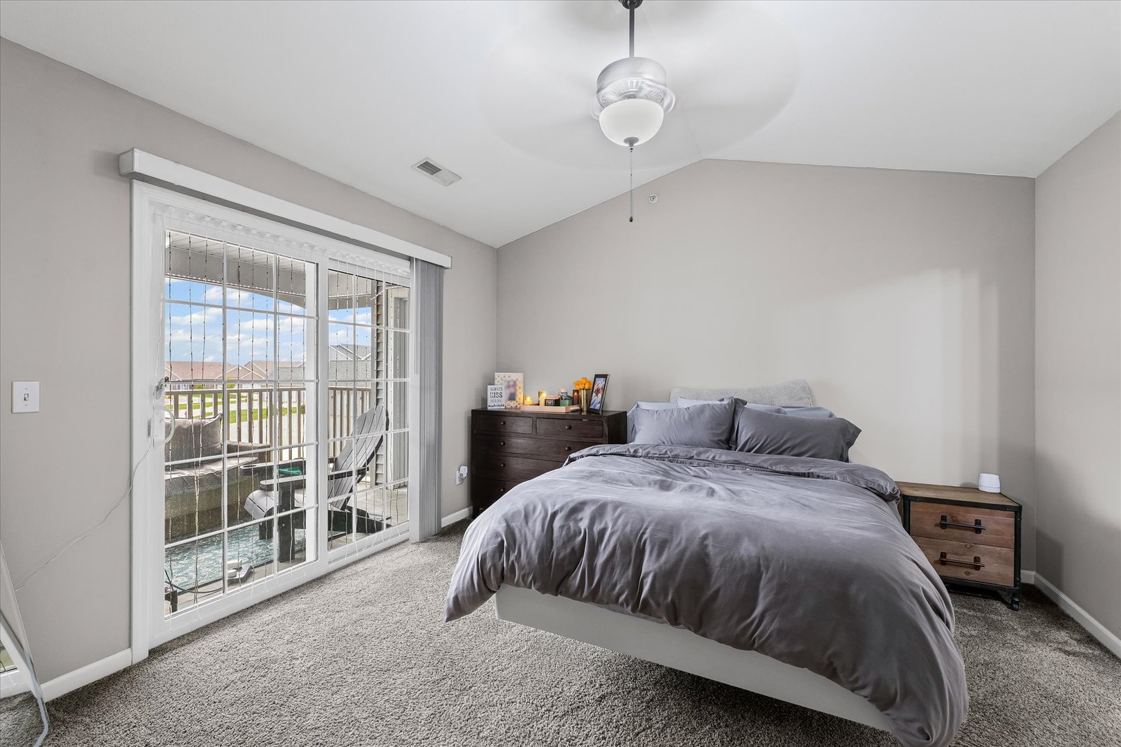 3044 East Stillwater Landing, Unit 201 Urbana, IL 61802 - Photo 24 of 28 a spacious bedroom with a bed and a tv