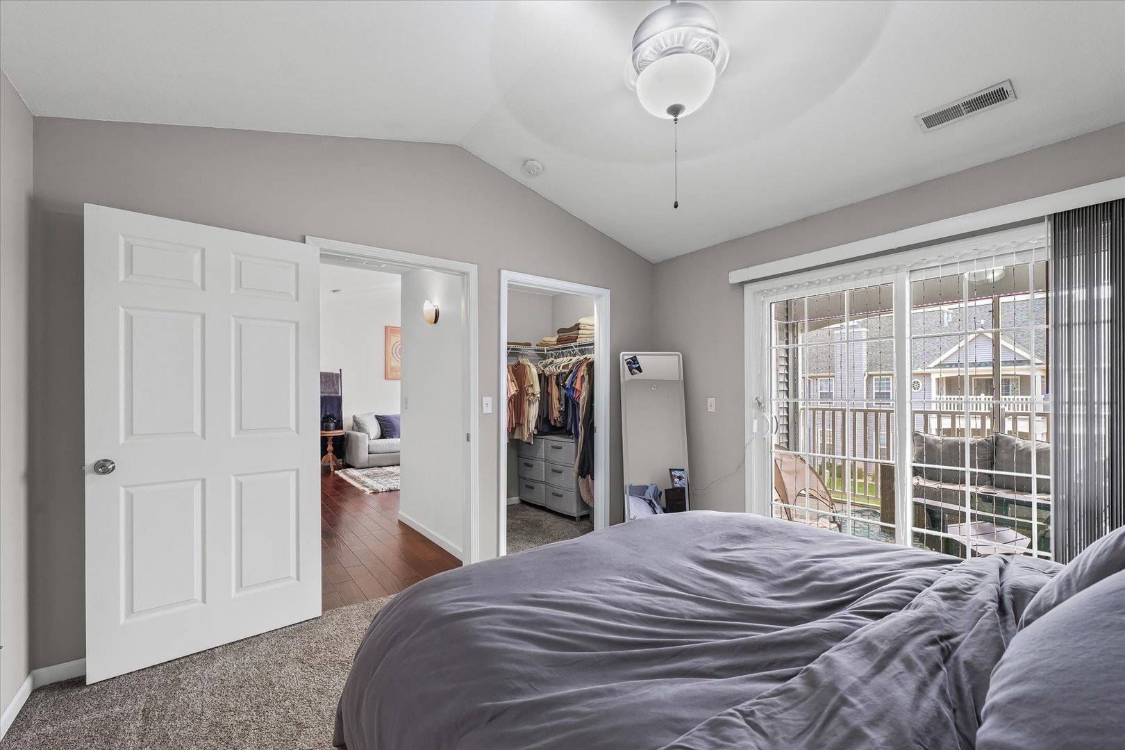3044 East Stillwater Landing, Unit 201 Urbana, IL 61802 - Photo 25 of 28 a bedroom with a bed and a large window