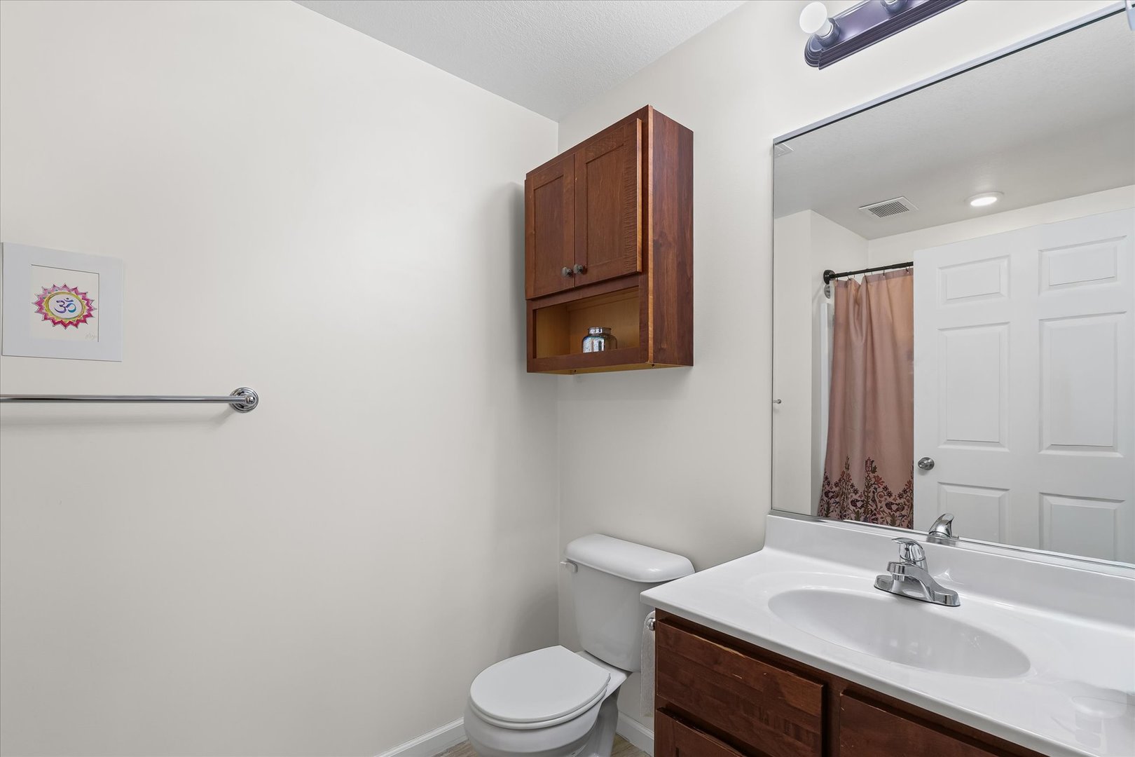 3044 East Stillwater Landing, Unit 201 Urbana, IL 61802 - Photo 26 of 28 a bathroom with a sink vanity mirror and toilet