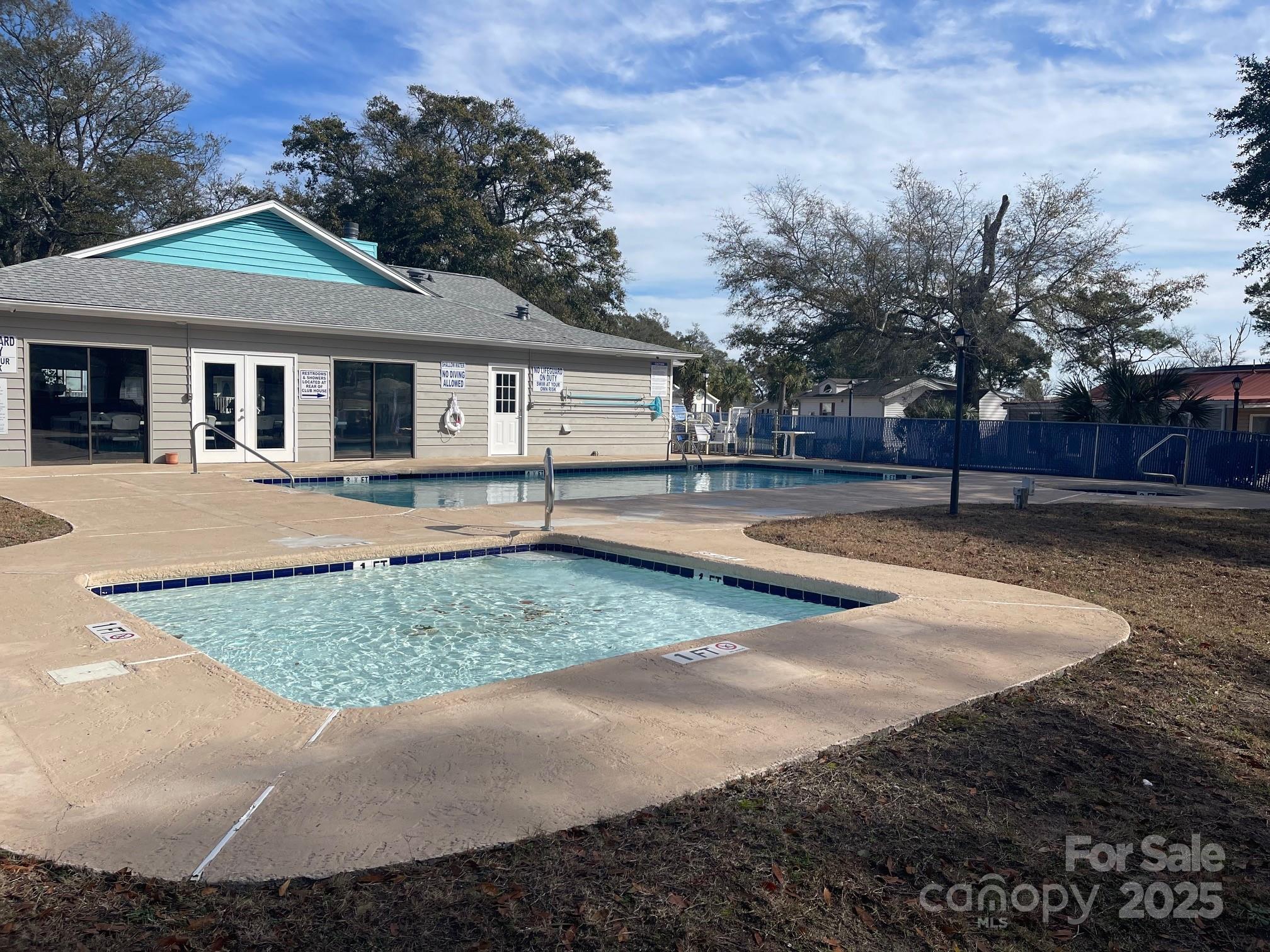 5400 Little River Neck Road, Unit 269 North Myrtle Beach, SC 29582 - Photo 20 of 22 a front view of a house with a yard