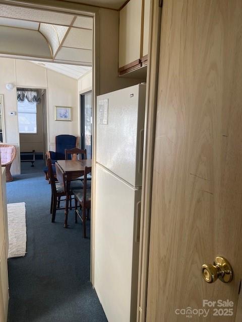 5400 Little River Neck Road, Unit 269 North Myrtle Beach, SC 29582 - Photo 9 of 22 a refrigerator and a stove sitting inside of a room