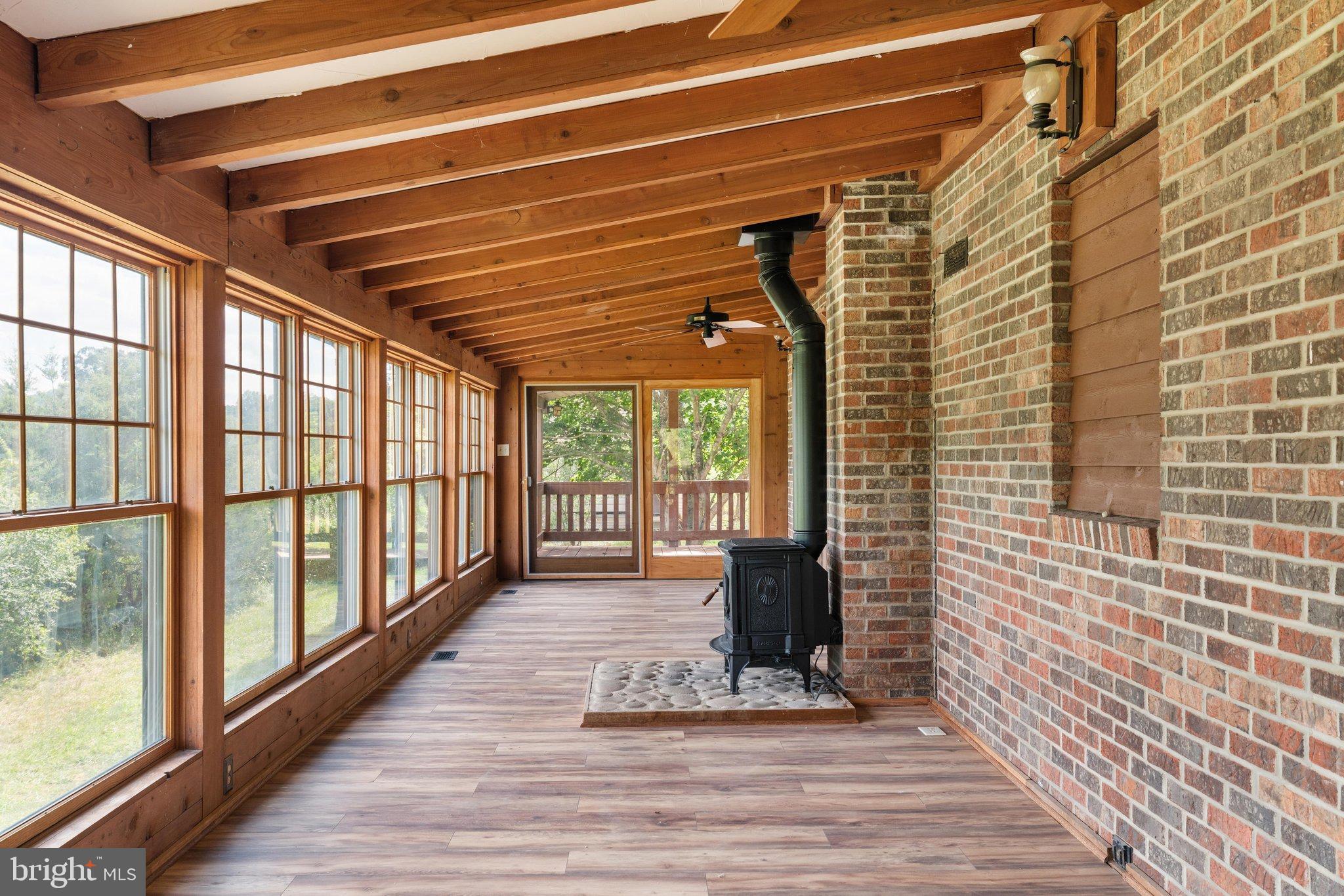134 Spring Mountain Way Fort Valley, VA 22652 - Photo 30 of 69 Back porch with wondows for year round comfort.