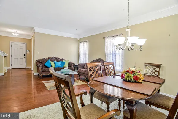 a large kitchen with stainless steel appliances granite countertop a stove and a sink