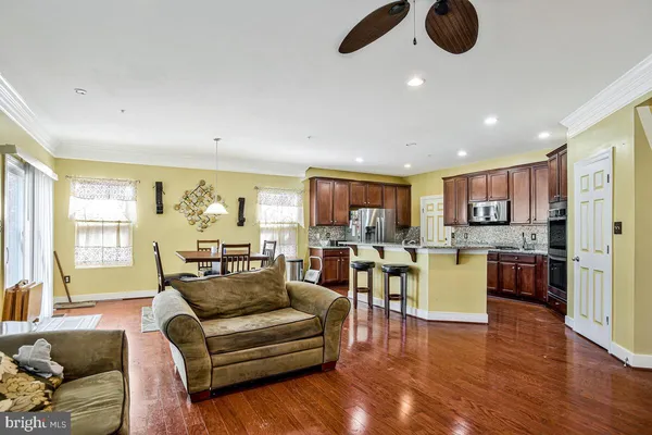 a room with a window and ceiling fan