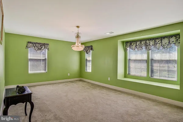 a bedroom with a bed and flat screen tv