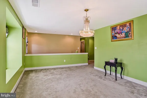 a bedroom with a bed dresser and a window