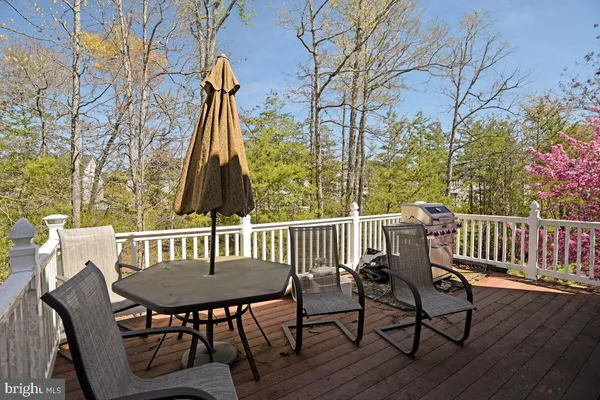 a view of a chairs and table on the deck
