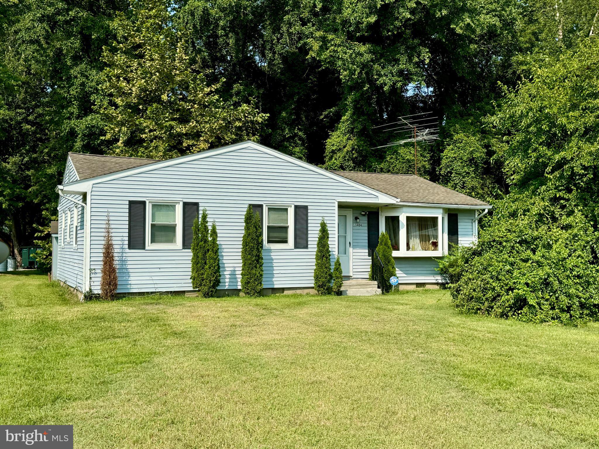 13404 Cannery Road Queen Anne, MD 21657 - Photo 1 of 14 a front view of house with yard and green space