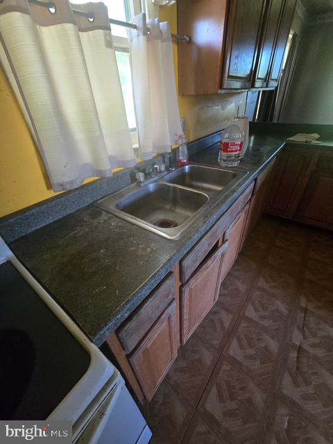 13404 Cannery Road Queen Anne, MD 21657 - Photo 14 of 14 a kitchen with stainless steel appliances granite countertop a sink a stove and a microwave