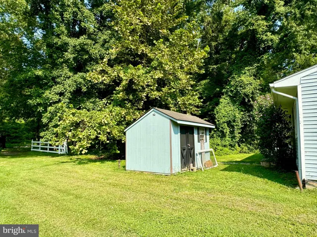 a house with trees in the background