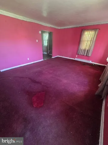 view of an empty room with a window