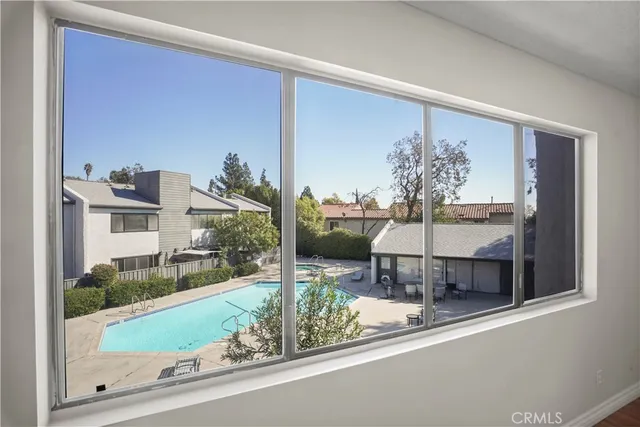 a living room with a table and chairs
