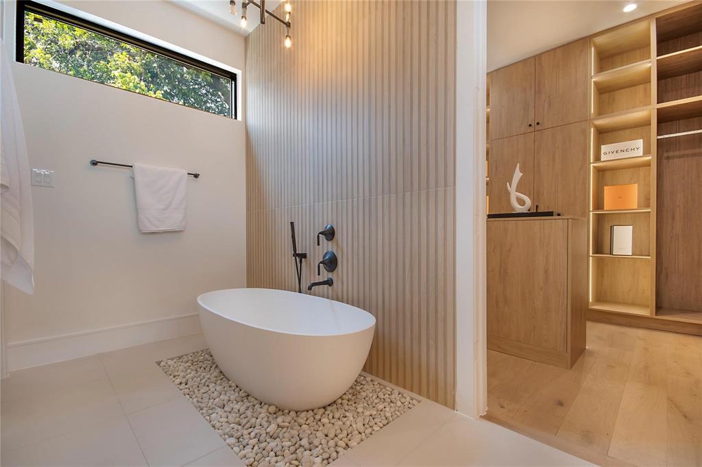 7619 Kenwell Street Dallas, TX 75209 - Photo 22 of 40 a bathroom with a toilet and shower