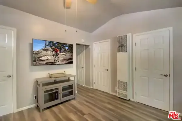 a view of a livingroom with wooden floor