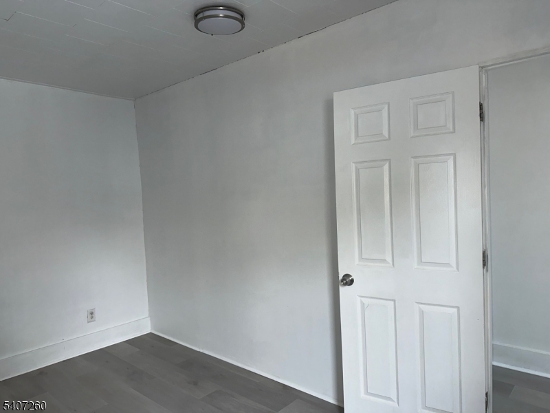 336 Broad Street, Unit 2 Bloomfield, NJ 07003 - Photo 17 of 24 an empty room with wooden floor