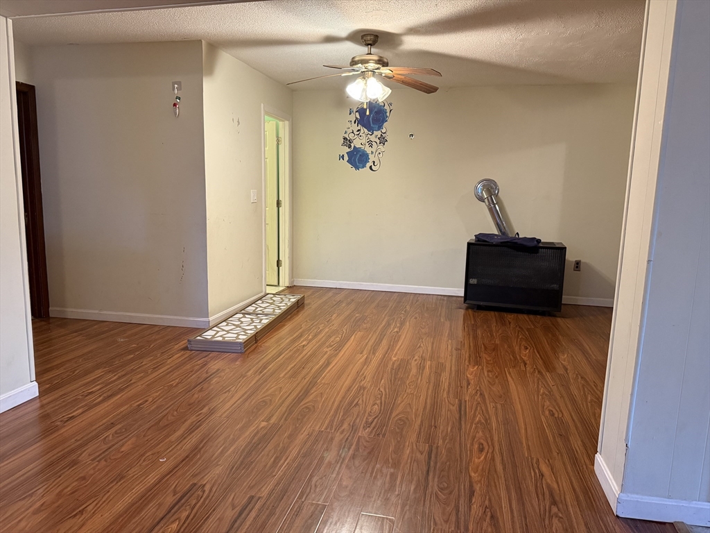 163 Warren Street, Unit 1 Fall River, MA 02721 - Photo 2 of 6 a view of a livingroom with wooden floor