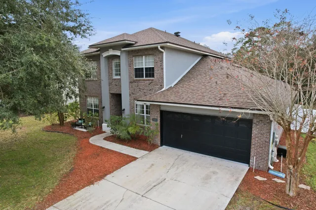 a front view of a house with yard