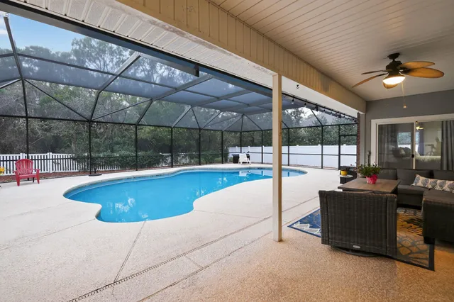 a swimming pool with potted plants