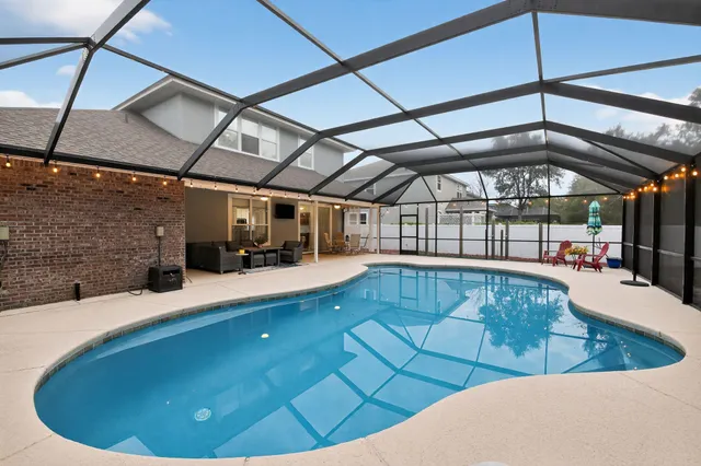 a view of a swimming pool with a patio