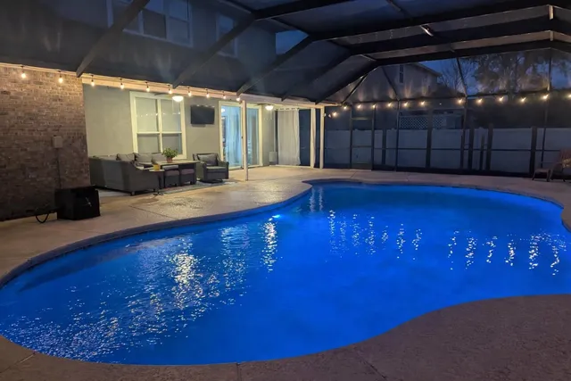 a view of swimming pool with seating area