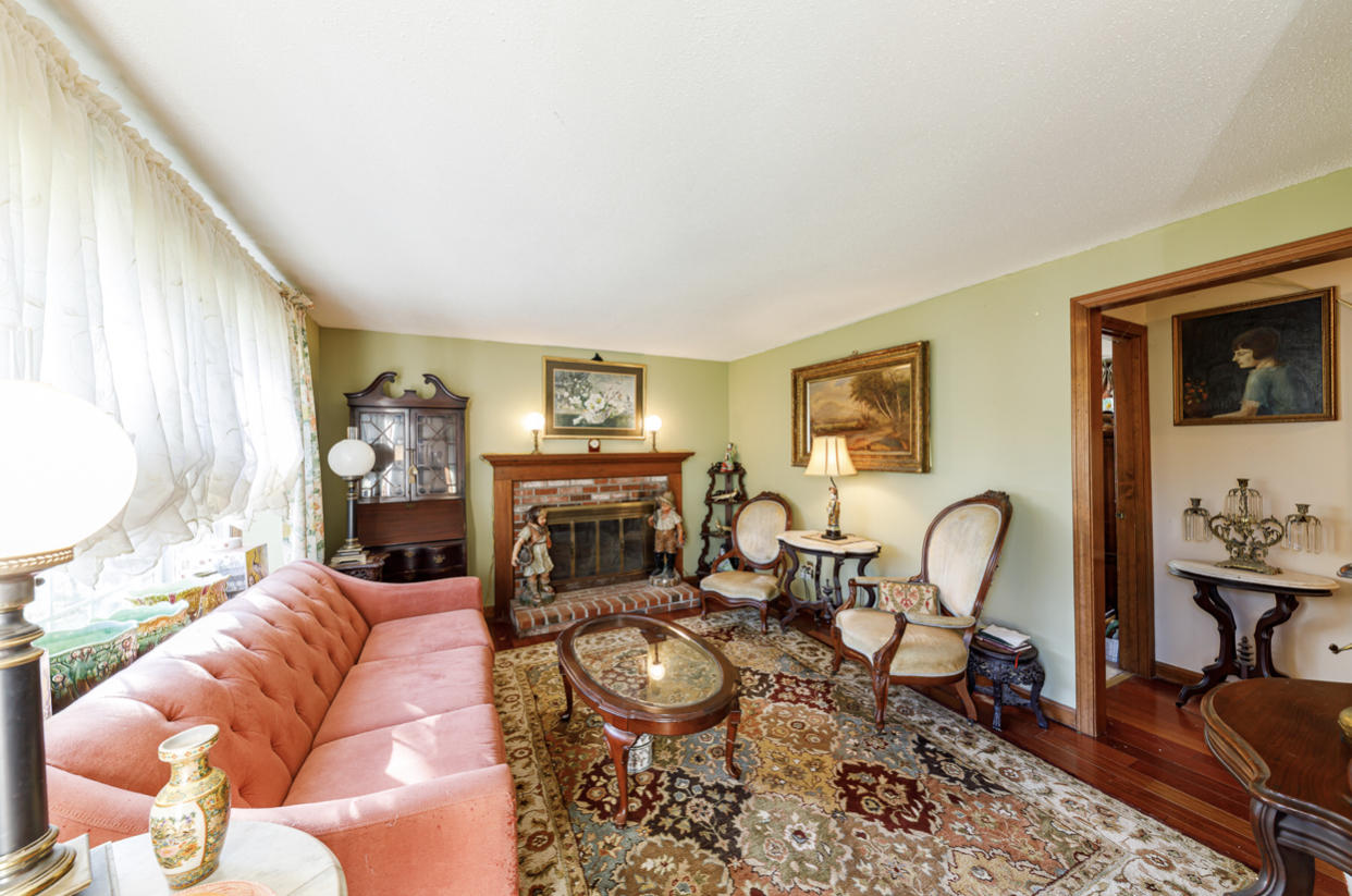 12 Ebenezer Road Osterville, MA 02655 - Photo 11 of 22 a living room with furniture a rug and a fireplace