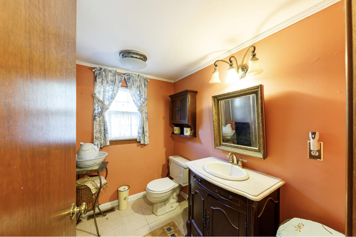 12 Ebenezer Road Osterville, MA 02655 - Photo 19 of 22 a bathroom with a toilet a sink and mirror