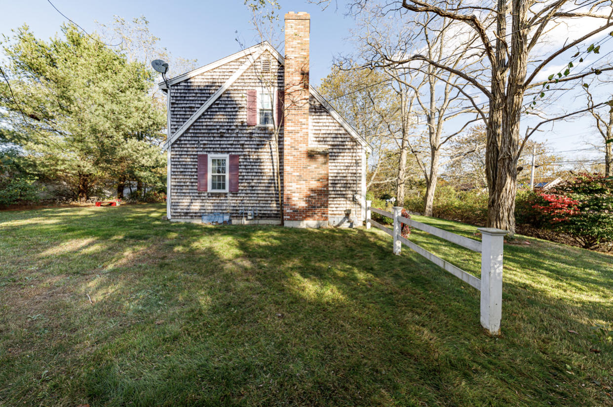12 Ebenezer Road Osterville, MA 02655 - Photo 5 of 22 a view of a house with a yard