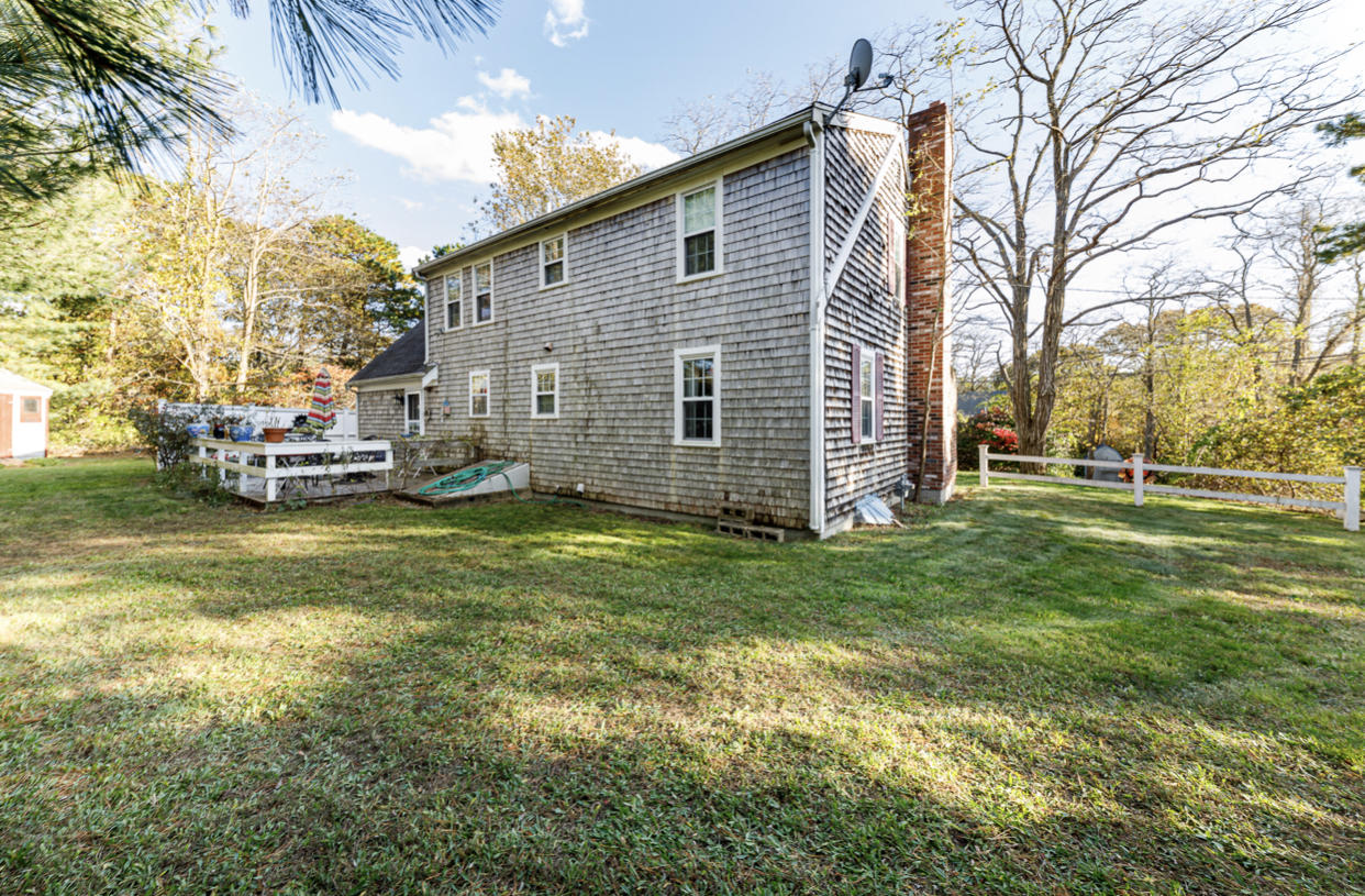 12 Ebenezer Road Osterville, MA 02655 - Photo 8 of 22 a front view of a house with a garden