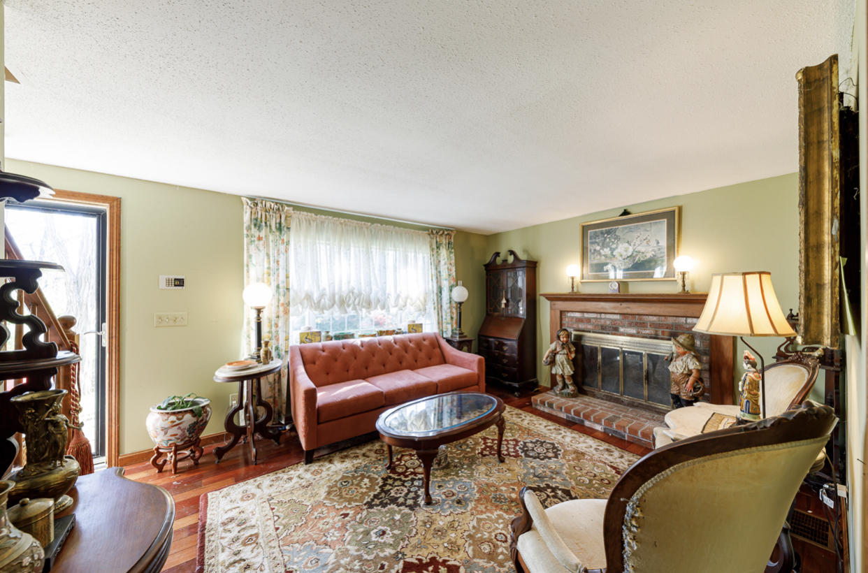 12 Ebenezer Road Osterville, MA 02655 - Photo 10 of 22 a living room with furniture a window and a fireplace