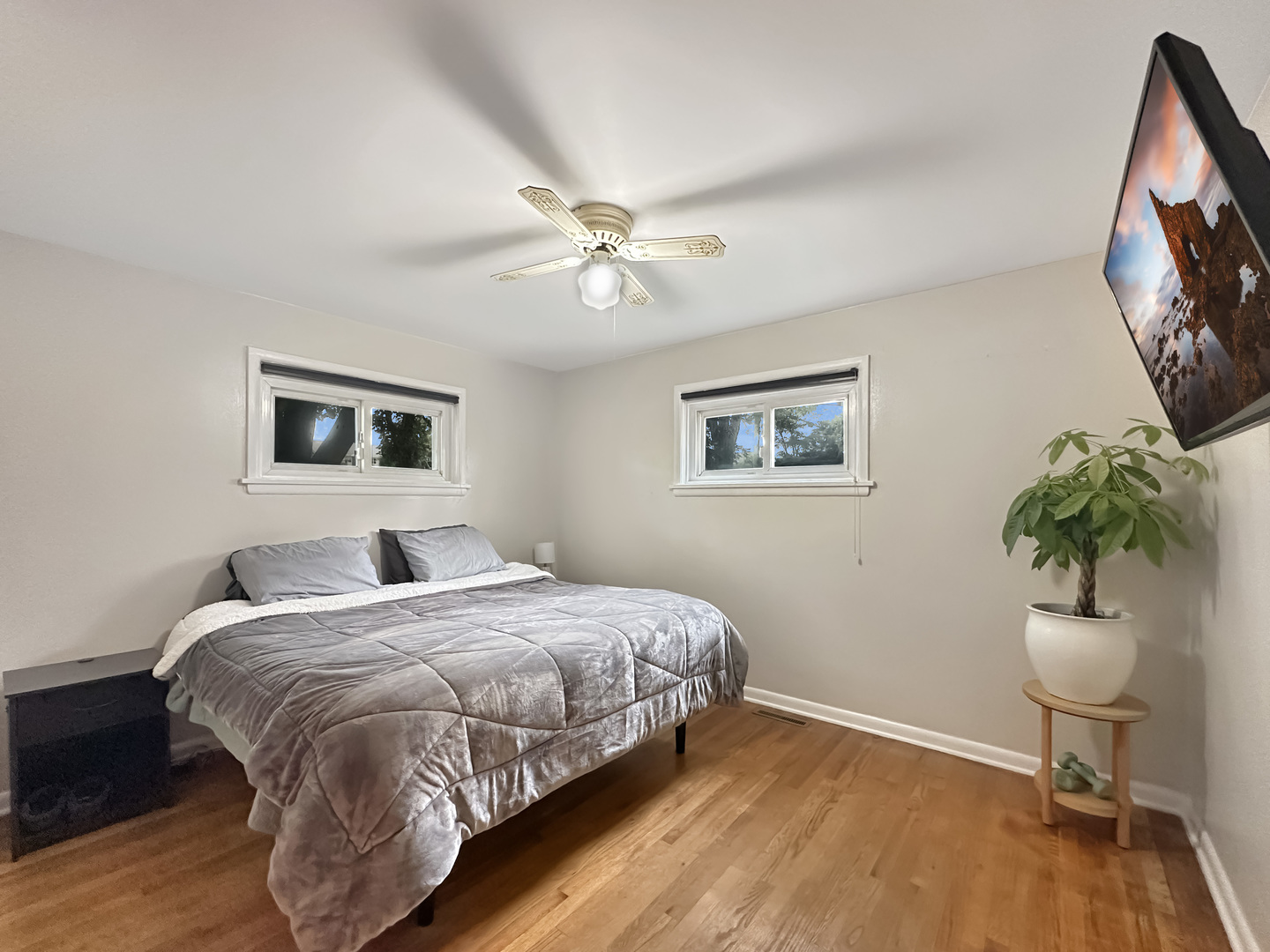 1 Hawthorne Road Lake In The Hills, IL 60156 - Photo 11 of 22 a bedroom with a bed and a chandelier