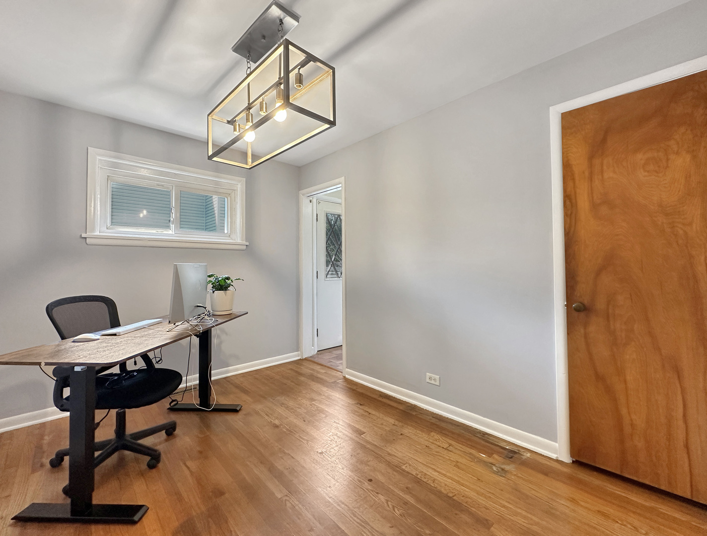 1 Hawthorne Road Lake In The Hills, IL 60156 - Photo 10 of 22 a workspace with wooden floor and a window