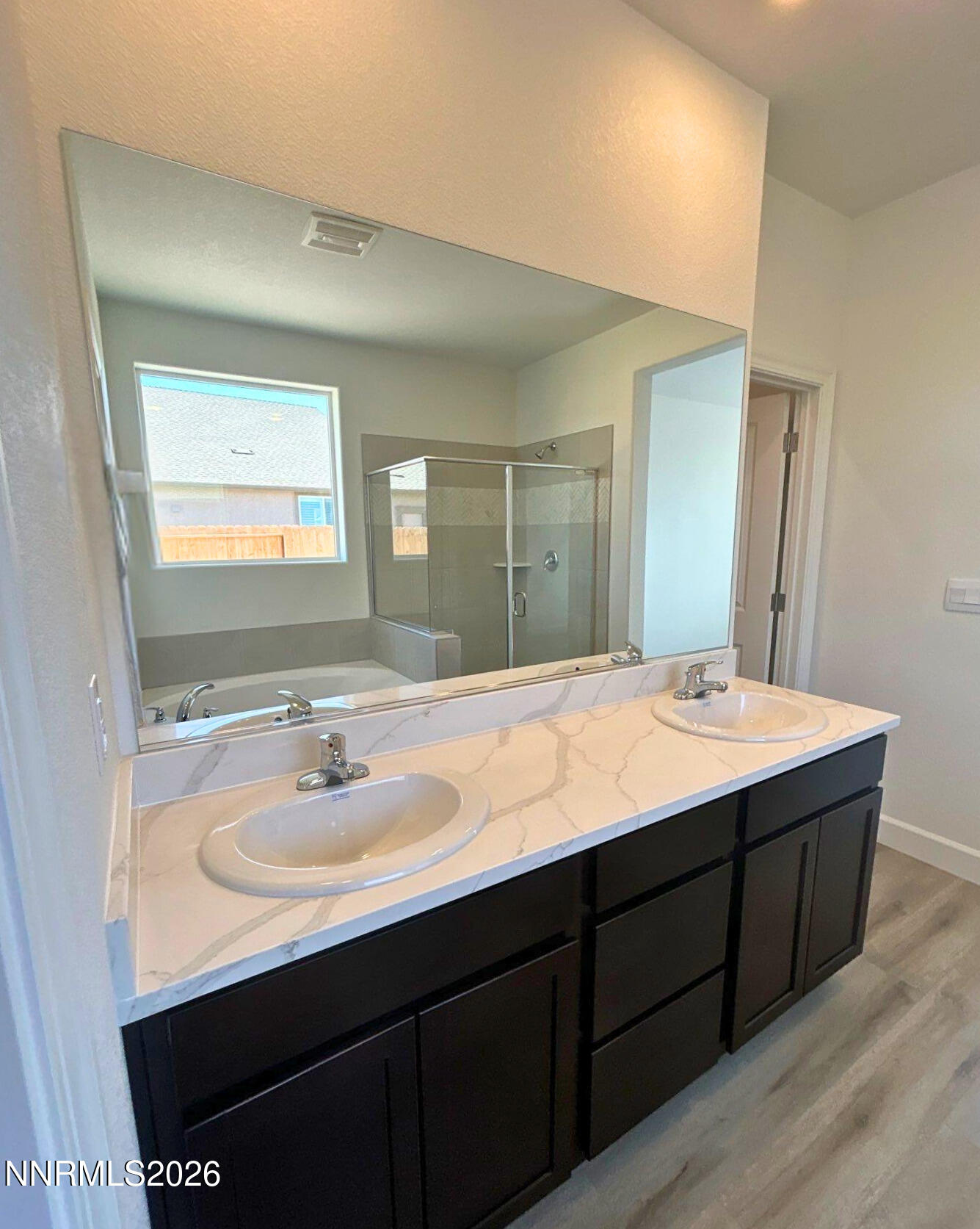 3453 Payton Way Fernley, NV 89408 - Photo 9 of 15 a bathroom with a sink double vanity and a mirror
