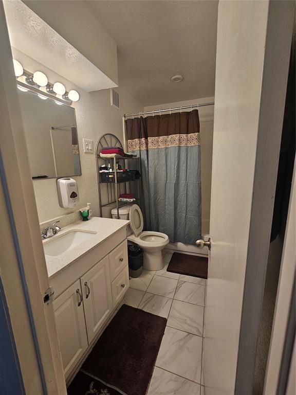 1823 East Grauwyler Road, Unit 198 Irving, TX 75061 - Photo 5 of 9 a view of bathroom with a sink and mirror