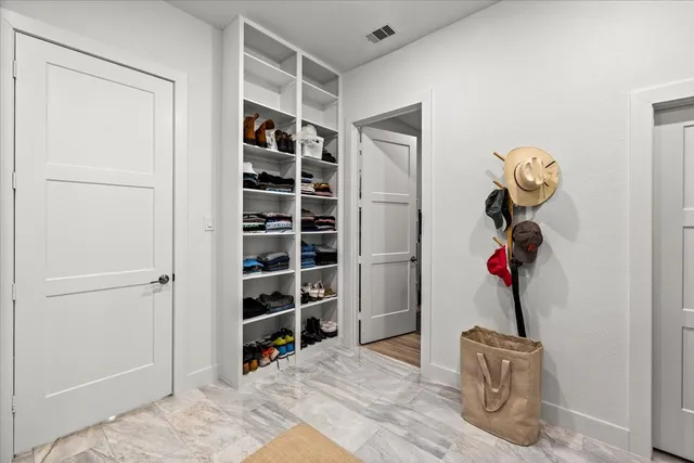 a bedroom with a bed and a table