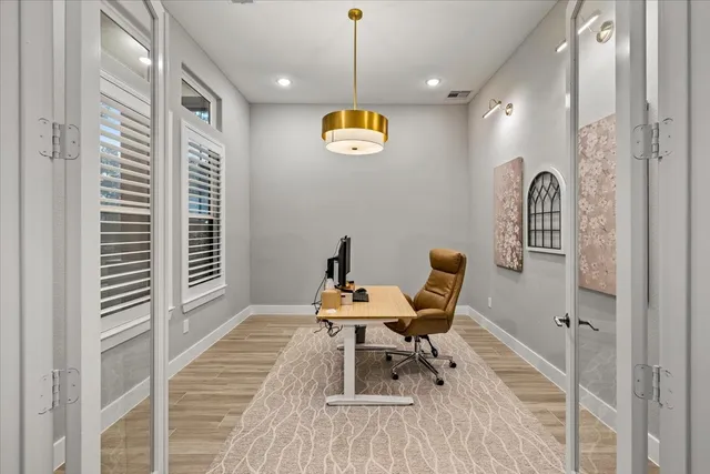 a living room with furniture large window and a fireplace