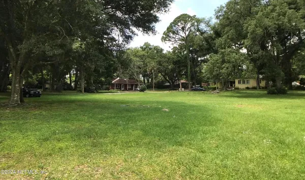 a view of a tree in front of a house