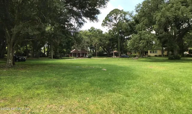 a view of a tree in front of a house