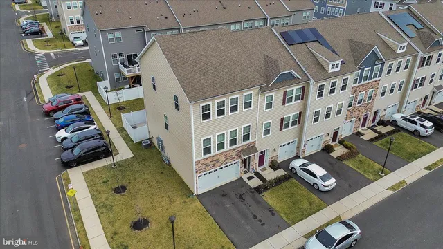 an aerial view of a residential apartment building with a swimming pool
