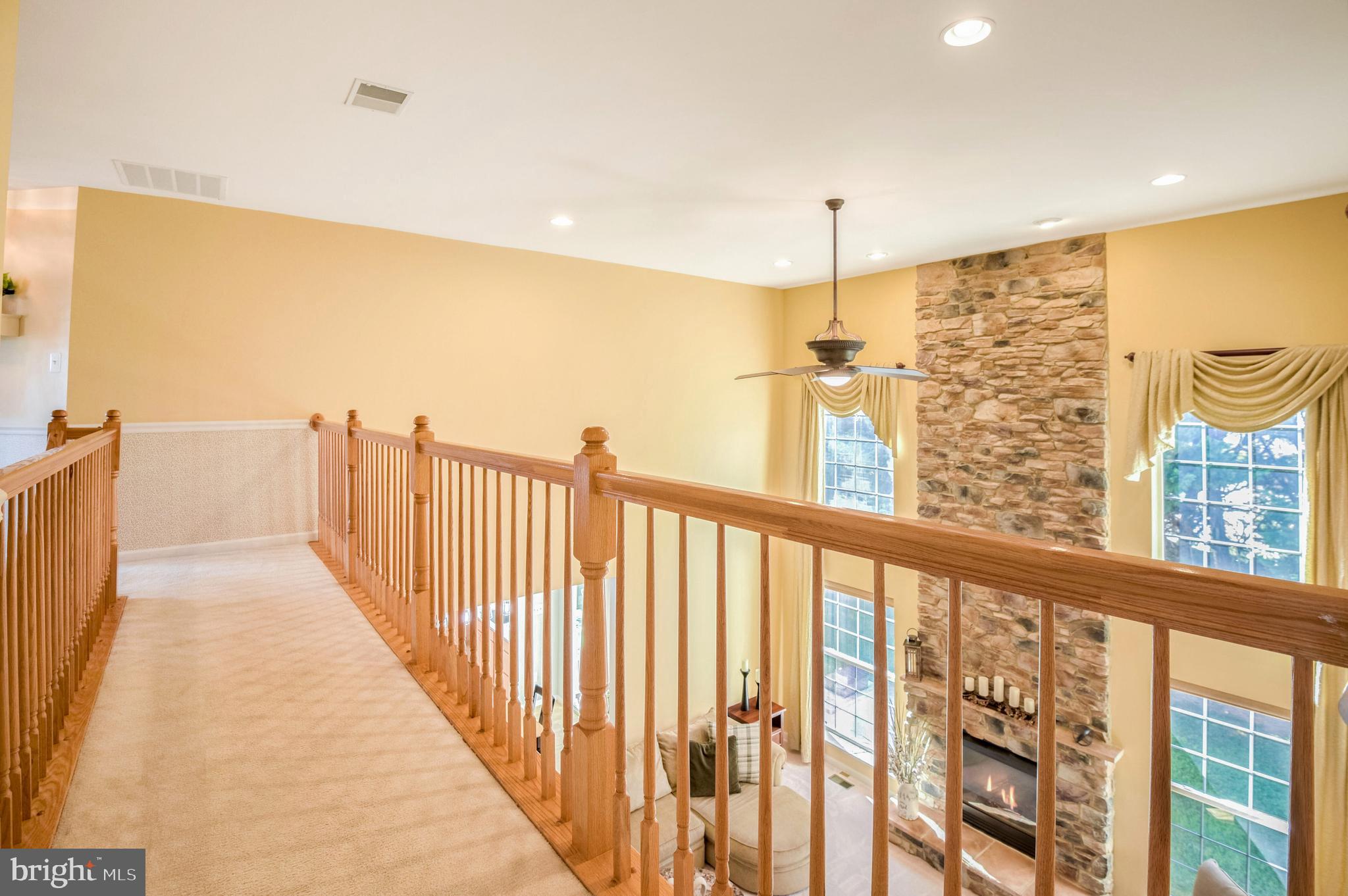 14004 Richter Farm Road Boyds, MD 20841 - Photo 28 of 50 Large picture windows flank fireplace