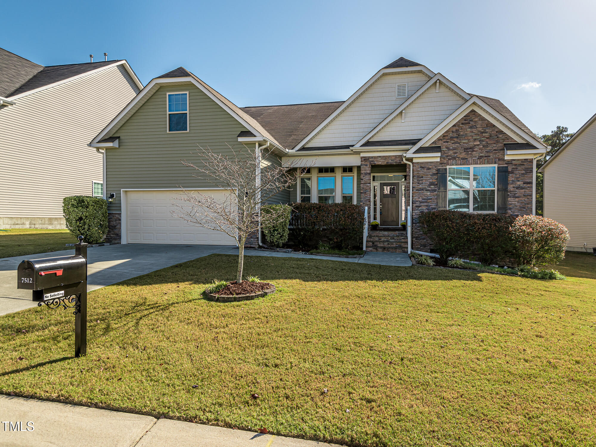 7512 Channery Way Raleigh, NC 27616 - Photo 1 of 45 a front view of a house with garden