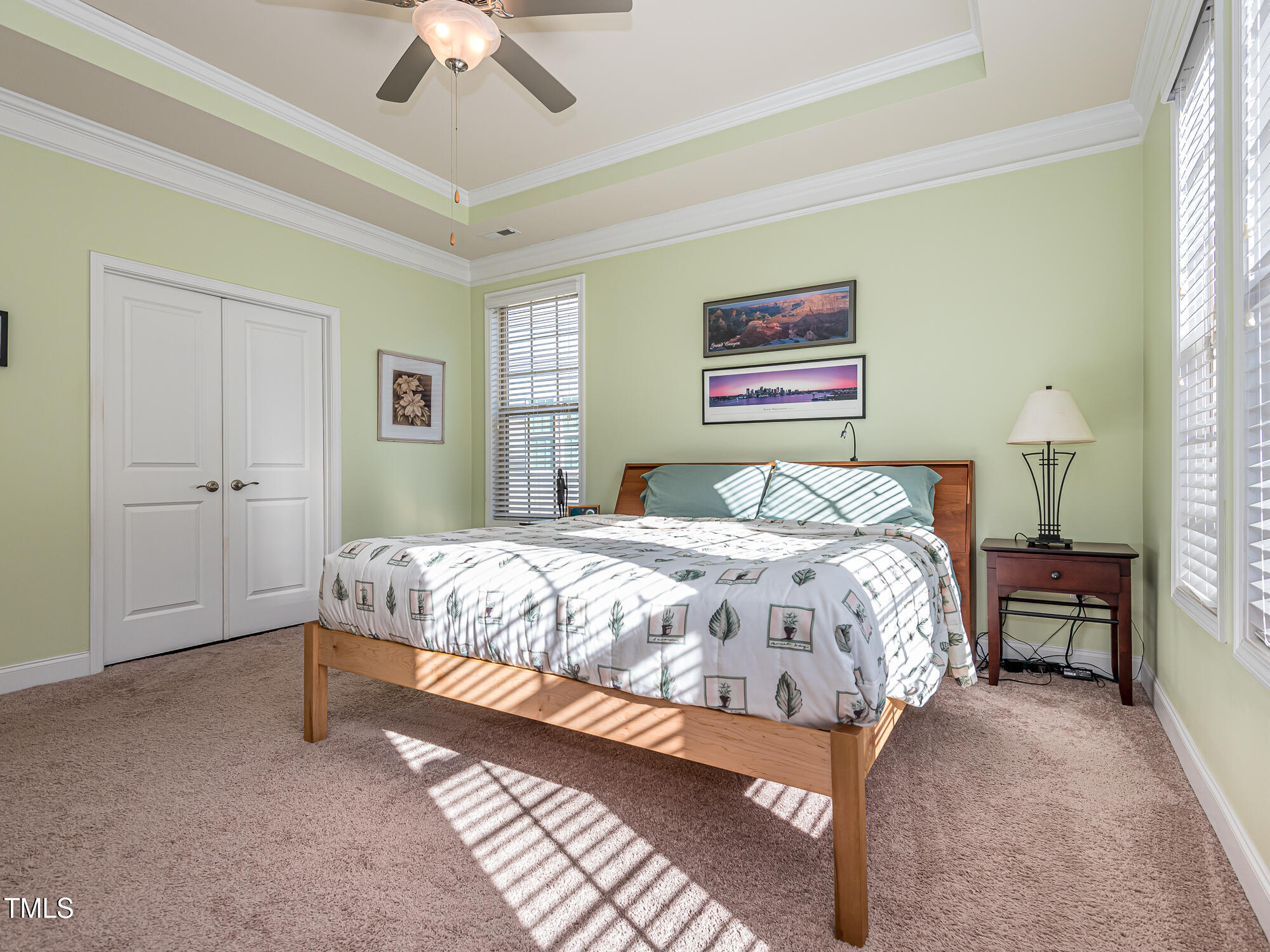 7512 Channery Way Raleigh, NC 27616 - Photo 19 of 45 a bedroom with a bed and a ceiling fan