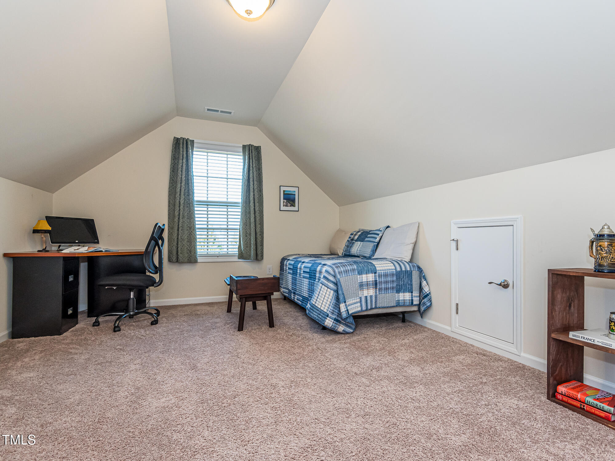 7512 Channery Way Raleigh, NC 27616 - Photo 26 of 45 a bedroom with a bed and a window
